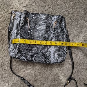 Black & gray snake skin print crossbody bag.